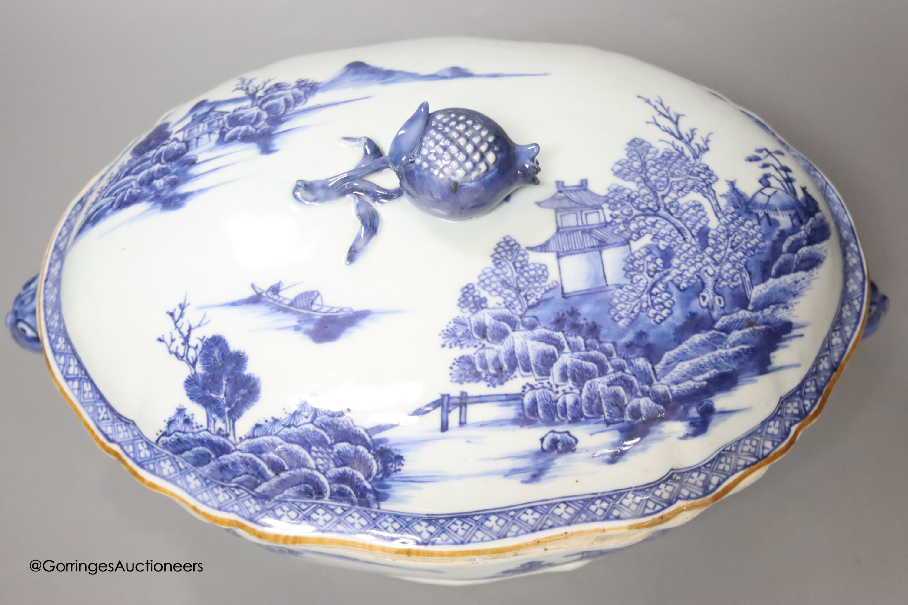 A 18th century Chinese export blue and white tureen and cover pomegranate finial, length 35cm